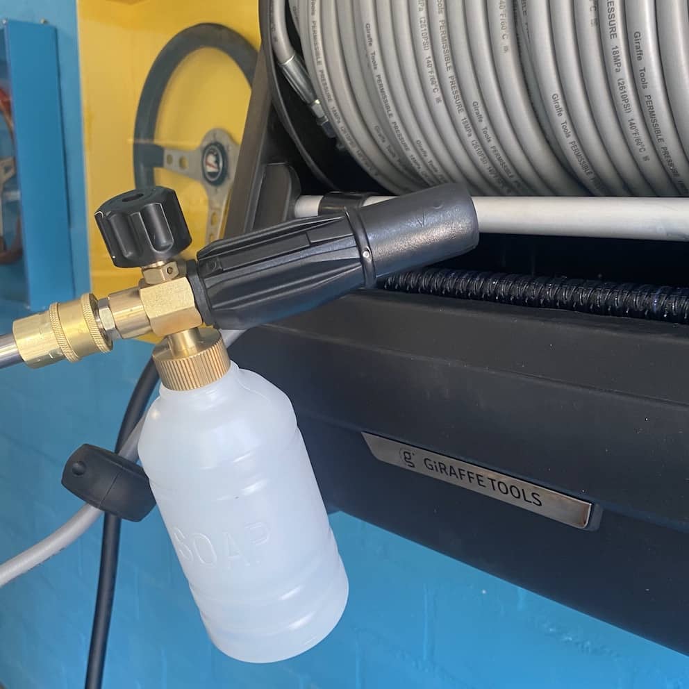 Soap Container of the Wall-Mounted Giraffe Tools Pressure Washer with Retractable Hose Soap Container of the Wall-Mounted Giraffe Tools Pressure Washer with Retractable Hose