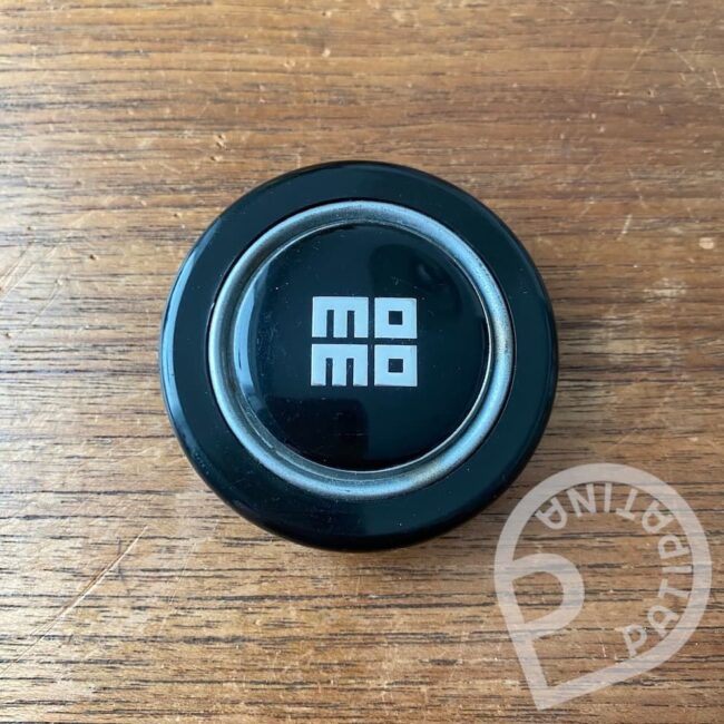 first generation early stacked Momo horn button